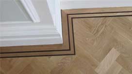 Hardwood flooring designs – picture frame border | Parquet Floor Fitters